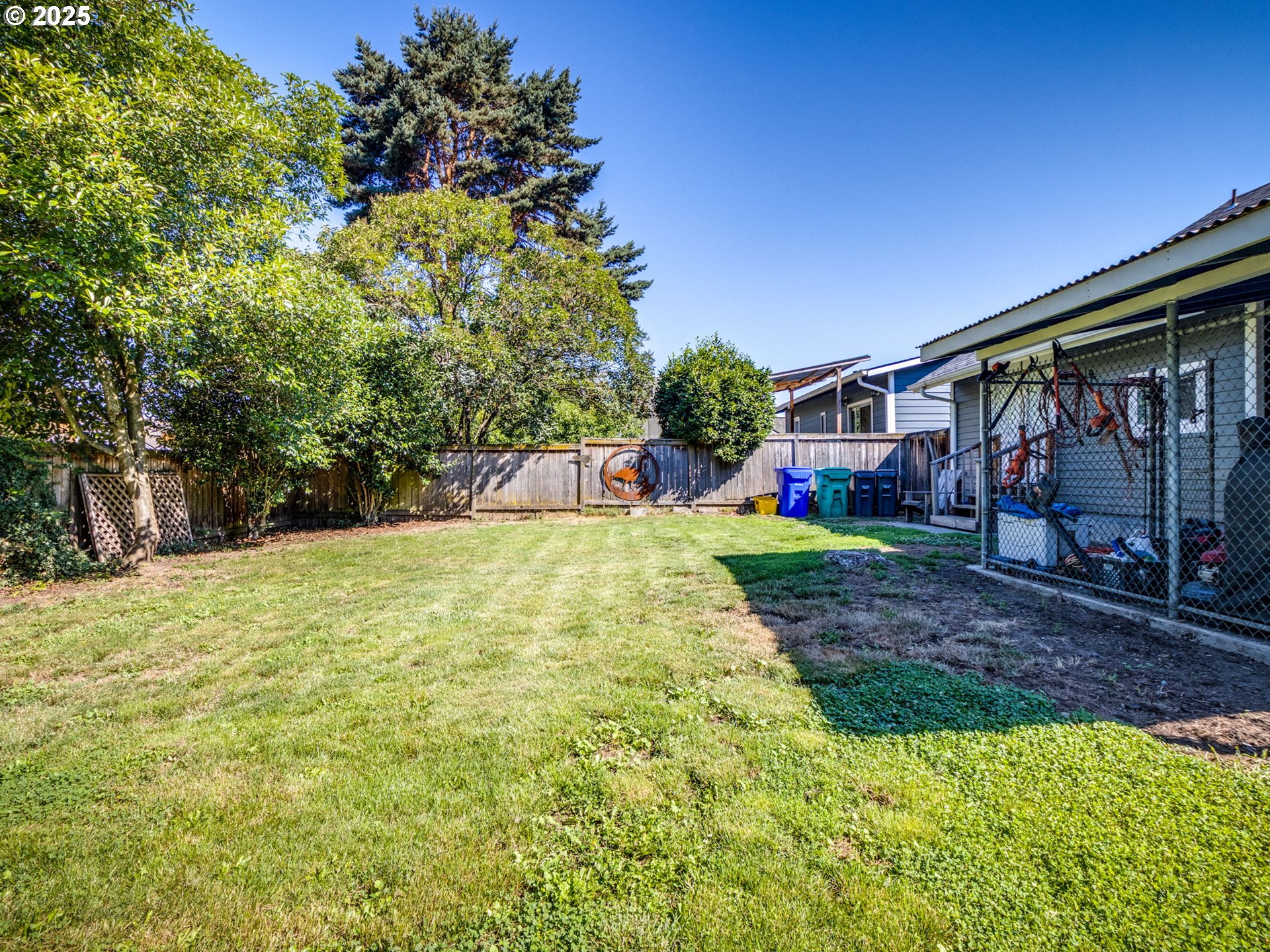 4731 Northeast 106th Avenue Portland, OR 97220 - Photo 38 of 44 a view of a backyard with large trees and plants