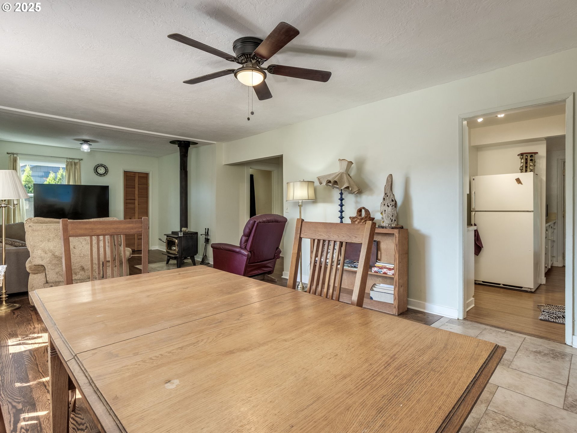 4731 Northeast 106th Avenue Portland, OR 97220 - Photo 9 of 44 a large bedroom with a bed and a flat screen tv
