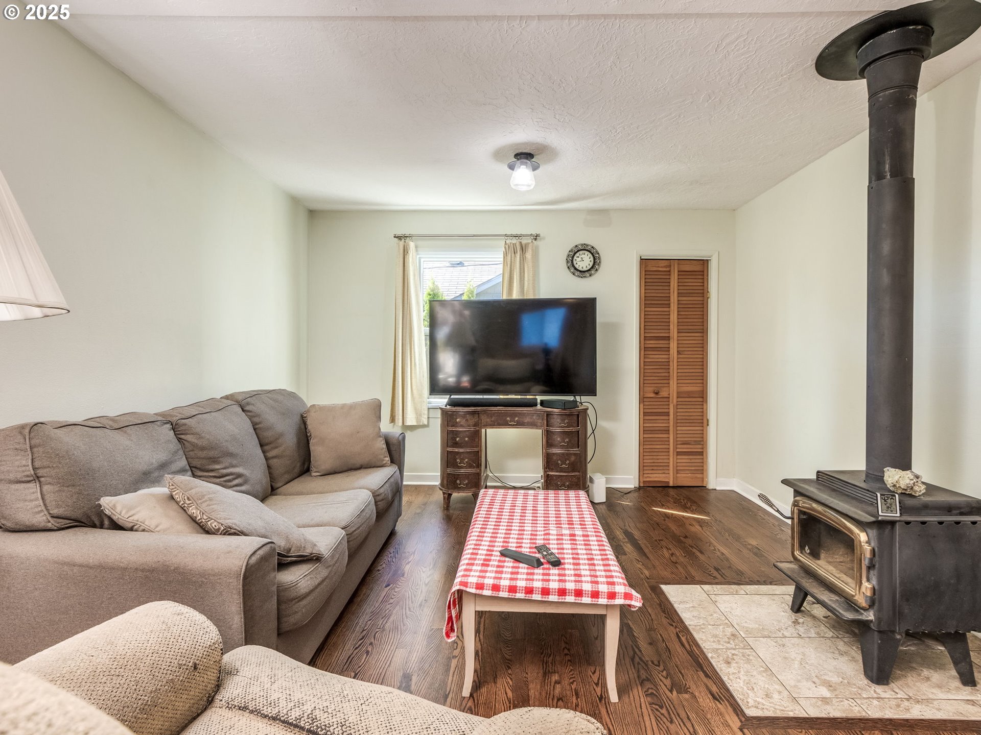4731 Northeast 106th Avenue Portland, OR 97220 - Photo 10 of 44 a living room with furniture and a flat screen tv