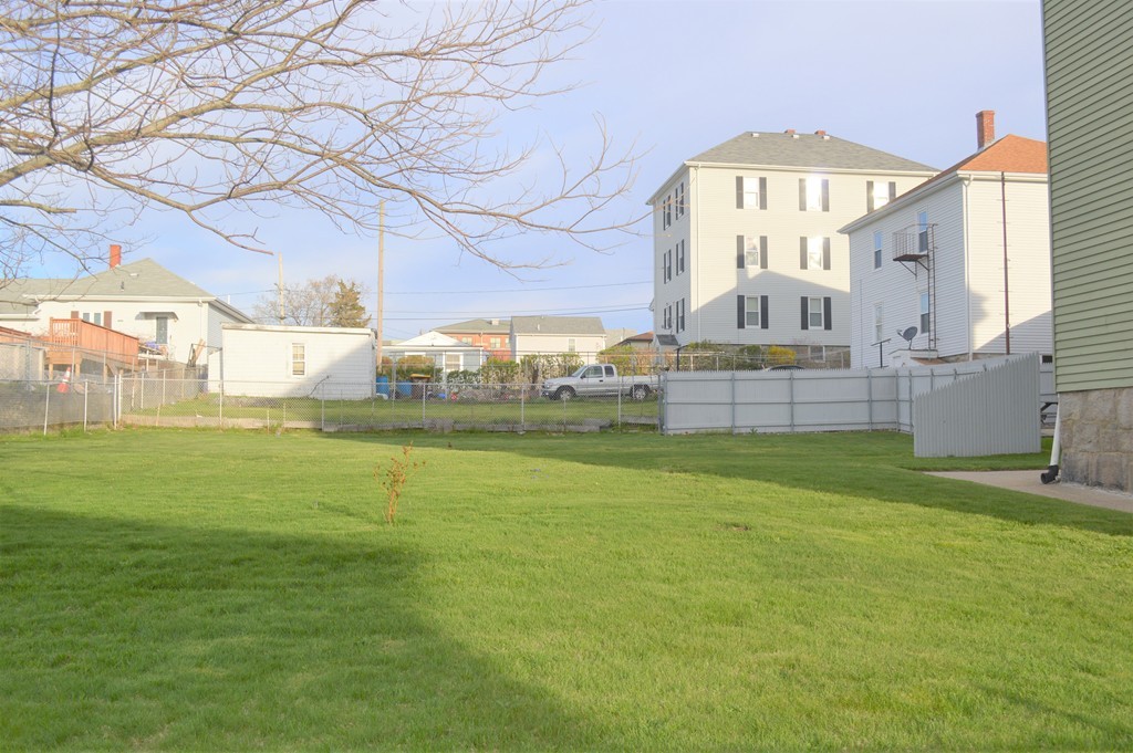 225 Baker Street Fall River, MA 02721 - Photo 5 of 5 a view of a house with a big yard