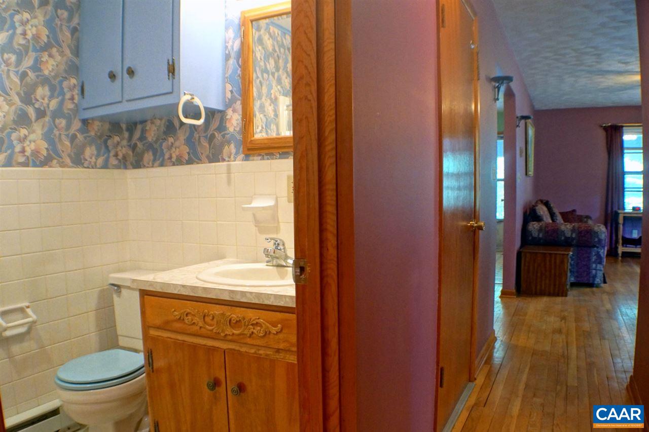 2000 Orange Road Pratts, VA 22731 - Photo 15 of 38 a bathroom with a sink a toilet and shower