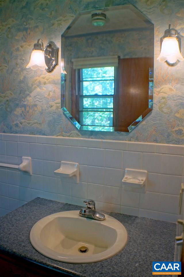 2000 Orange Road Pratts, VA 22731 - Photo 20 of 38 a bathroom with a sink and a mirror