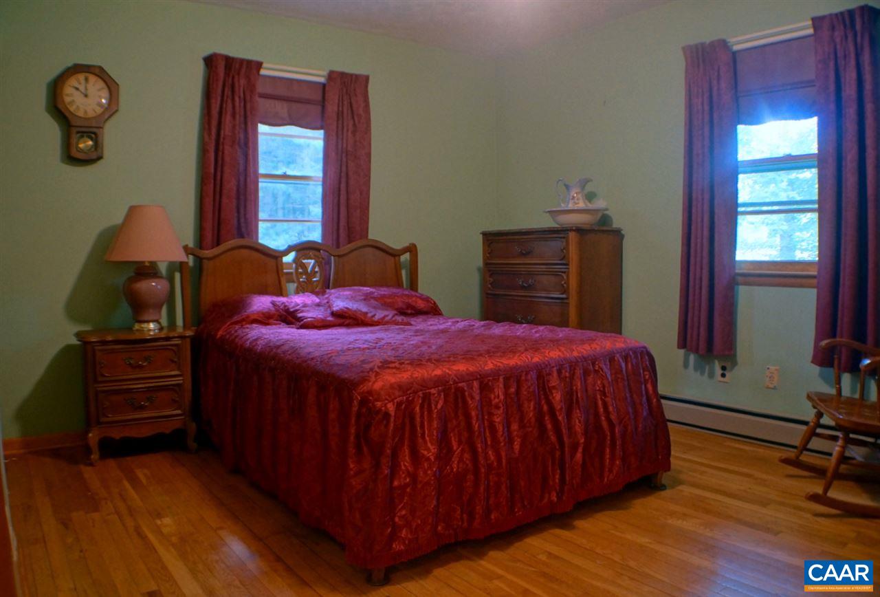 2000 Orange Road Pratts, VA 22731 - Photo 21 of 38 a bed sitting in a bedroom next to a window