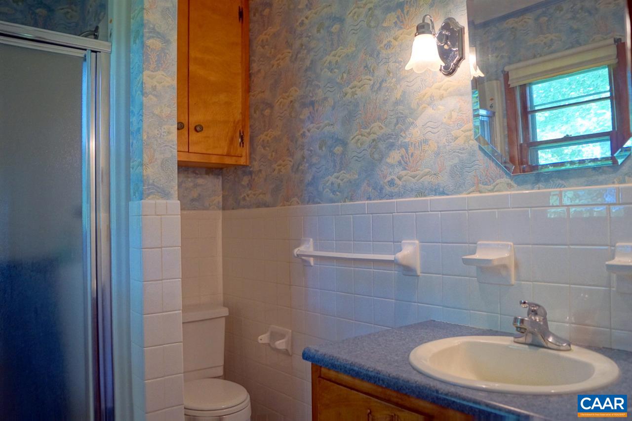 2000 Orange Road Pratts, VA 22731 - Photo 22 of 38 a bathroom with a sink toilet and mirror