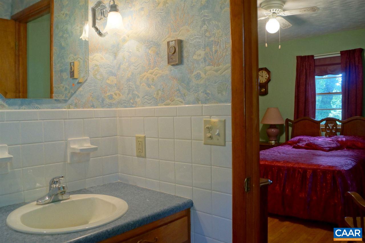 2000 Orange Road Pratts, VA 22731 - Photo 24 of 38 a bathroom with a sink a toilet and shower