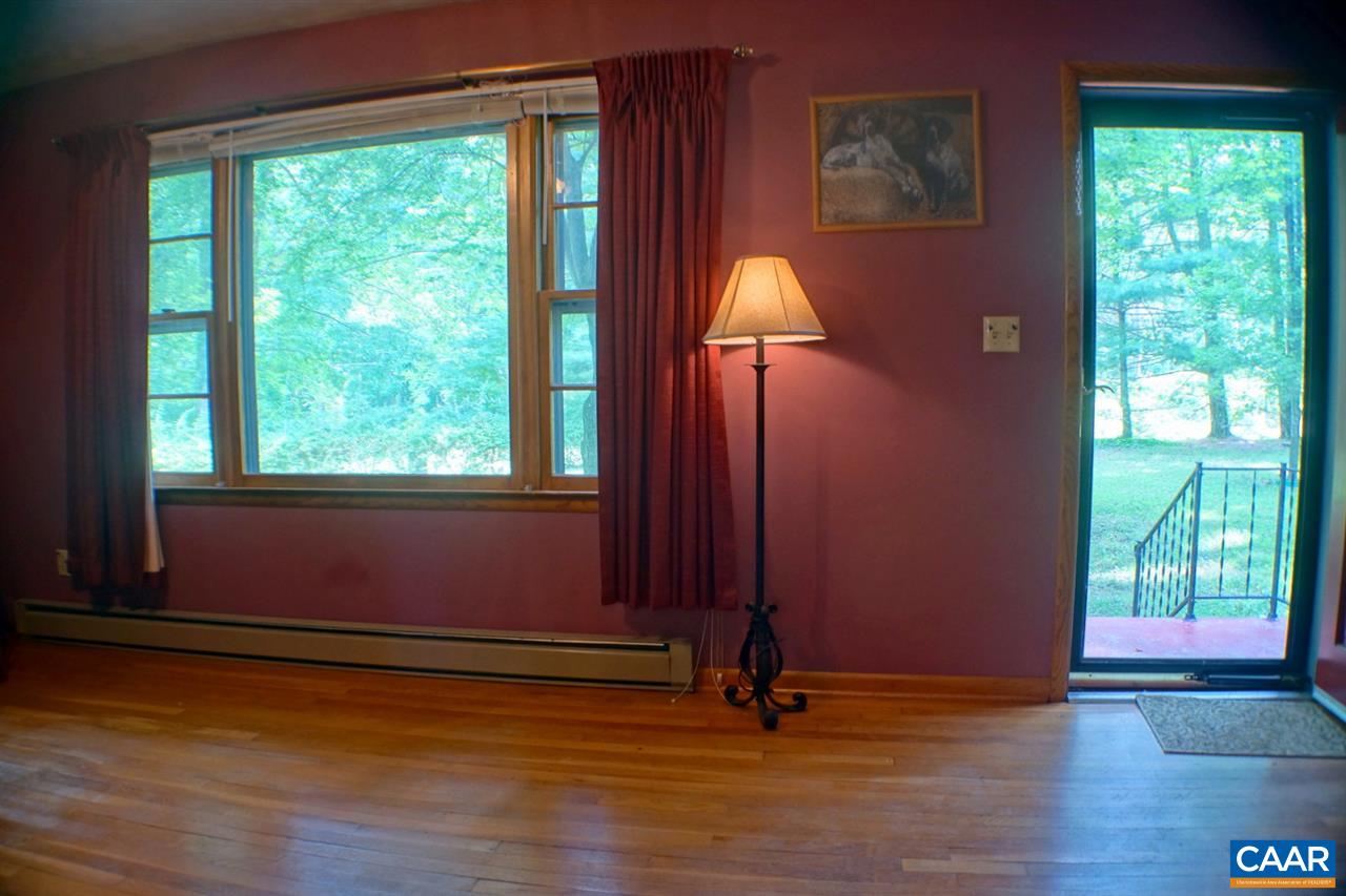 2000 Orange Road Pratts, VA 22731 - Photo 9 of 38 a view of empty room with wooden floor and fan