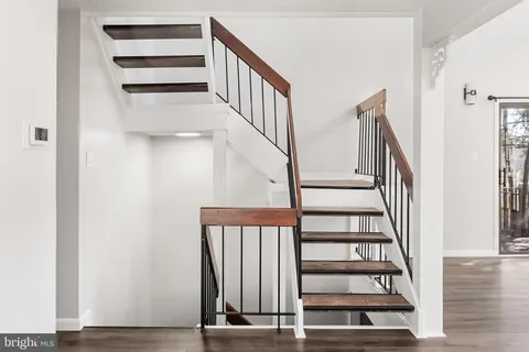 a view of entryway with wooden floor