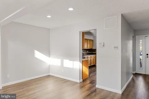 wooden floor in an empty room and a window