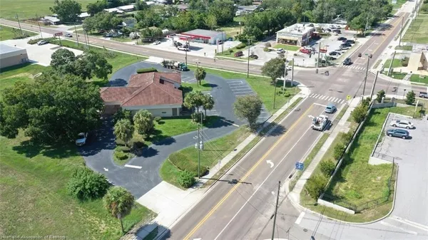 an aerial view of a residential houses with outdoor space