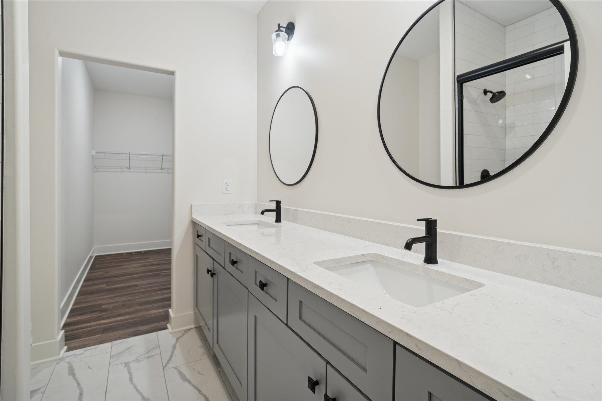 505 Anjali Court Sycamore, IL 60178 - Photo 22 of 47 a bathroom with a sink and a mirror