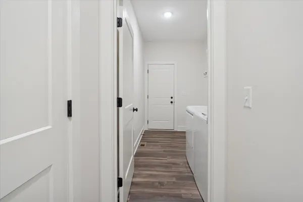 a view of a bathroom from the hallway