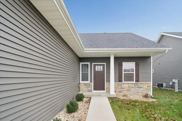 a view of hallway with wooden floor