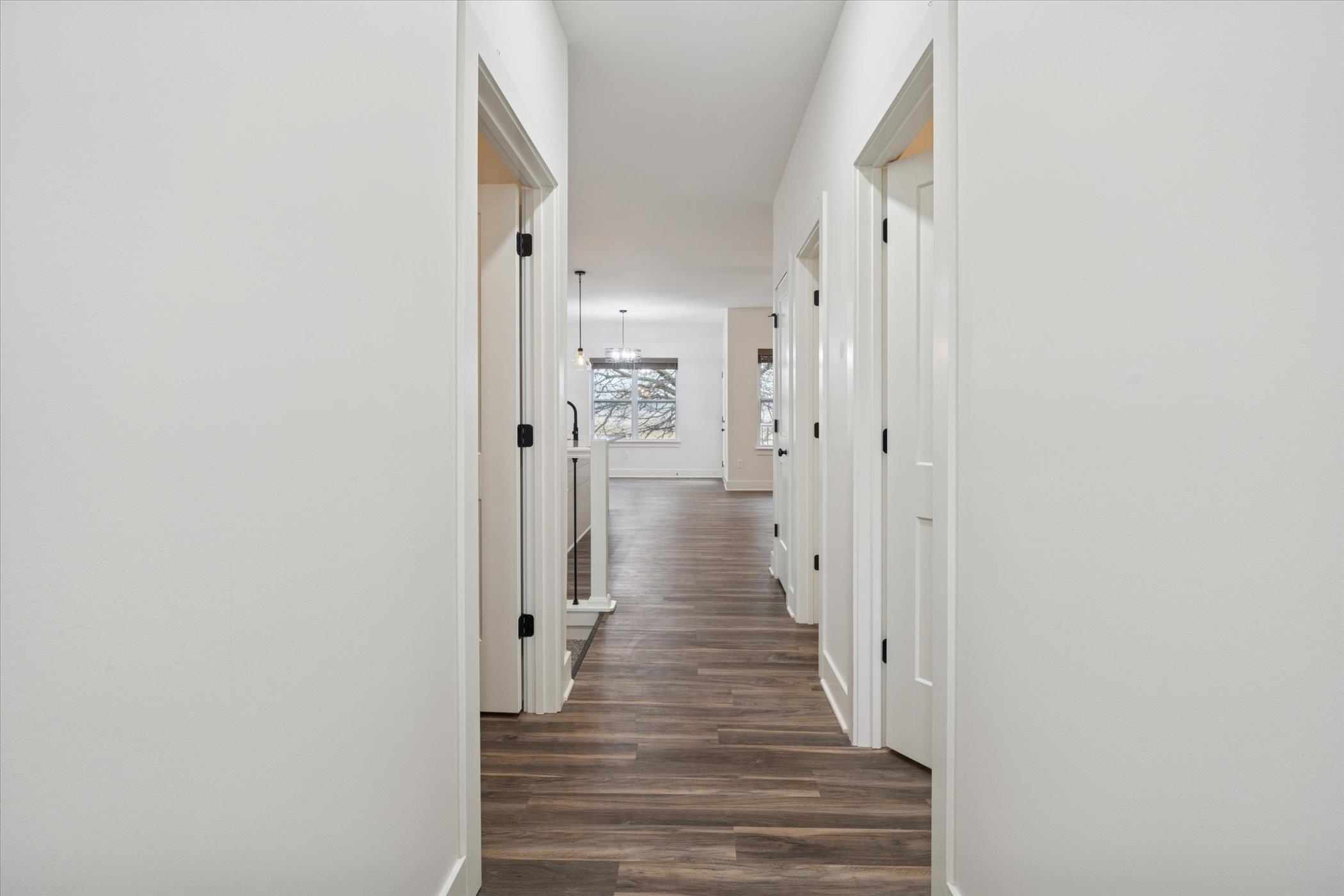 505 Anjali Court Sycamore, IL 60178 - Photo 29 of 47 a view of a hallway with wooden floor and staircase