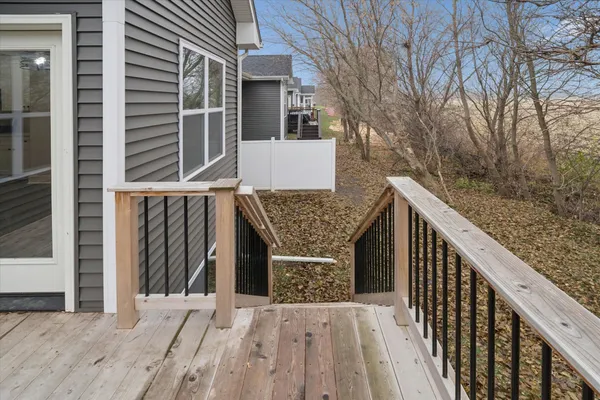 a balcony view with wooden floor and electric fence