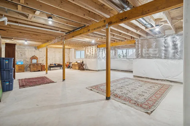 a view of a room with cars parked