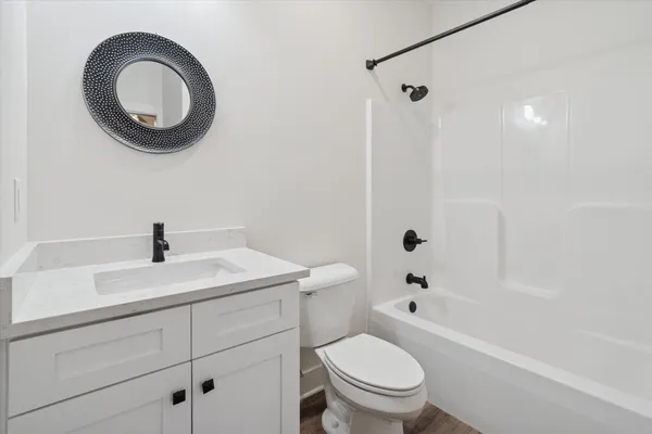 a living room with a couch and a chair