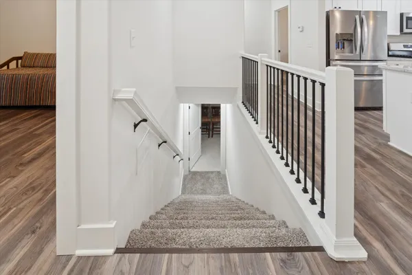 a view of a hallway with chandelier