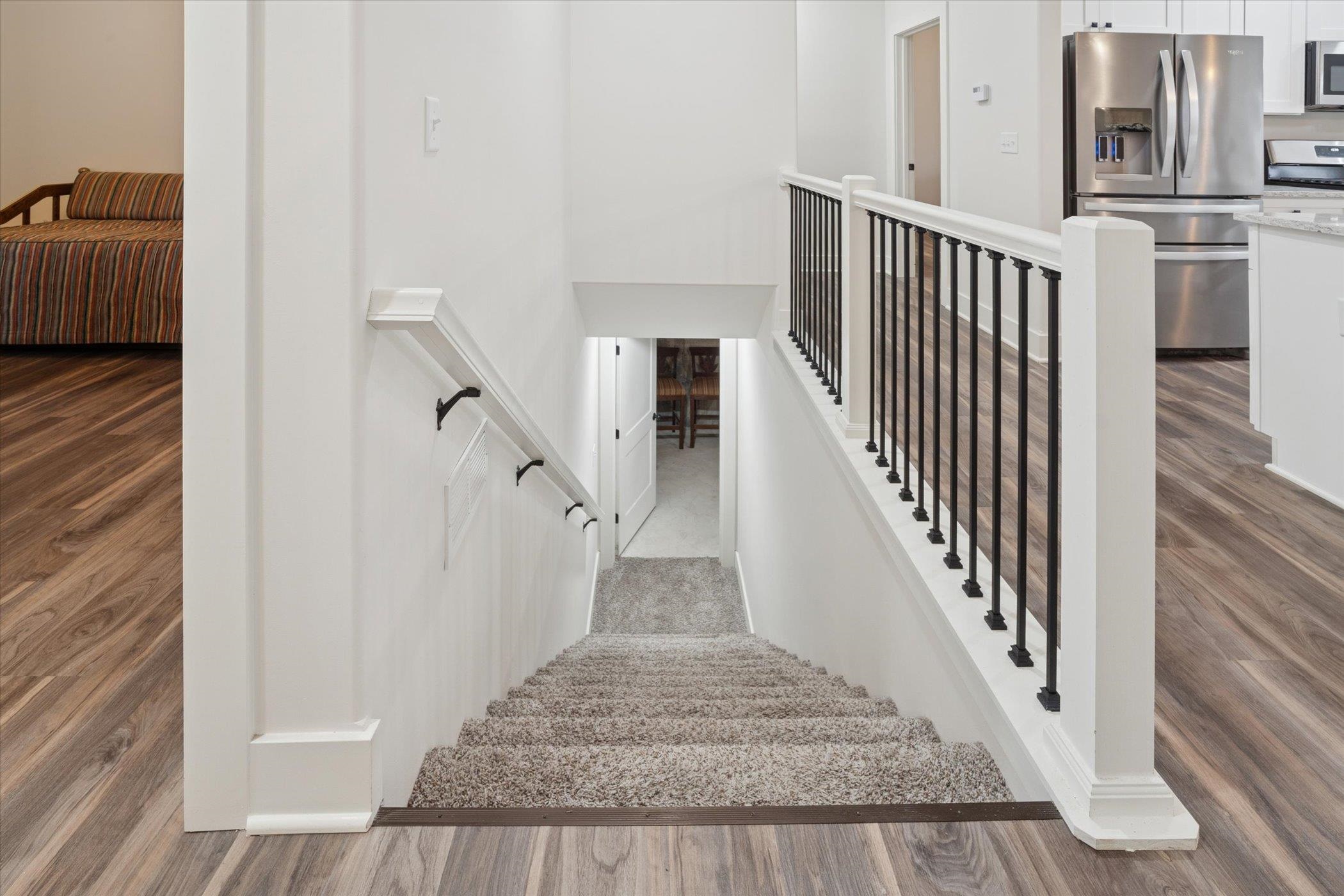 505 Anjali Court Sycamore, IL 60178 - Photo 44 of 47 a view of staircase with lots of frames on wall and windows