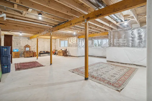 a view of a room with cars parked