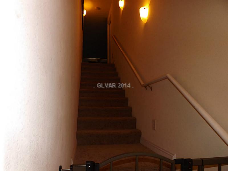 4528 Catfish Bend Road North Las Vegas, NV 89031 - Photo 25 of 28 Property Photo. Stairs to Loft and Storage Area