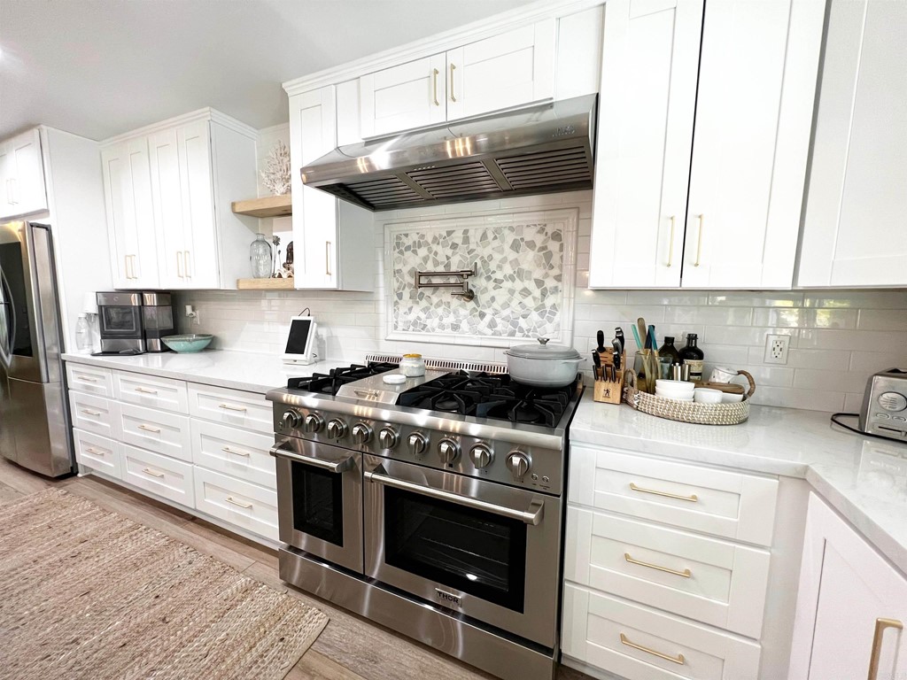 3583 Hatfield Circle Oceanside, CA 92056 - Photo 11 of 32 a kitchen with stainless steel appliances a stove sink and cabinets