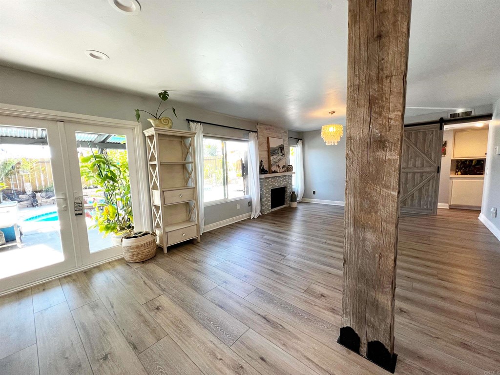 3583 Hatfield Circle Oceanside, CA 92056 - Photo 14 of 32 an empty room with wooden floor and windows