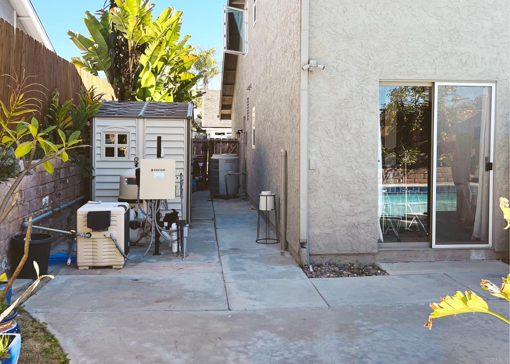 3583 Hatfield Circle Oceanside, CA 92056 - Photo 22 of 32 a view of a patio with table and chairs and potted plants