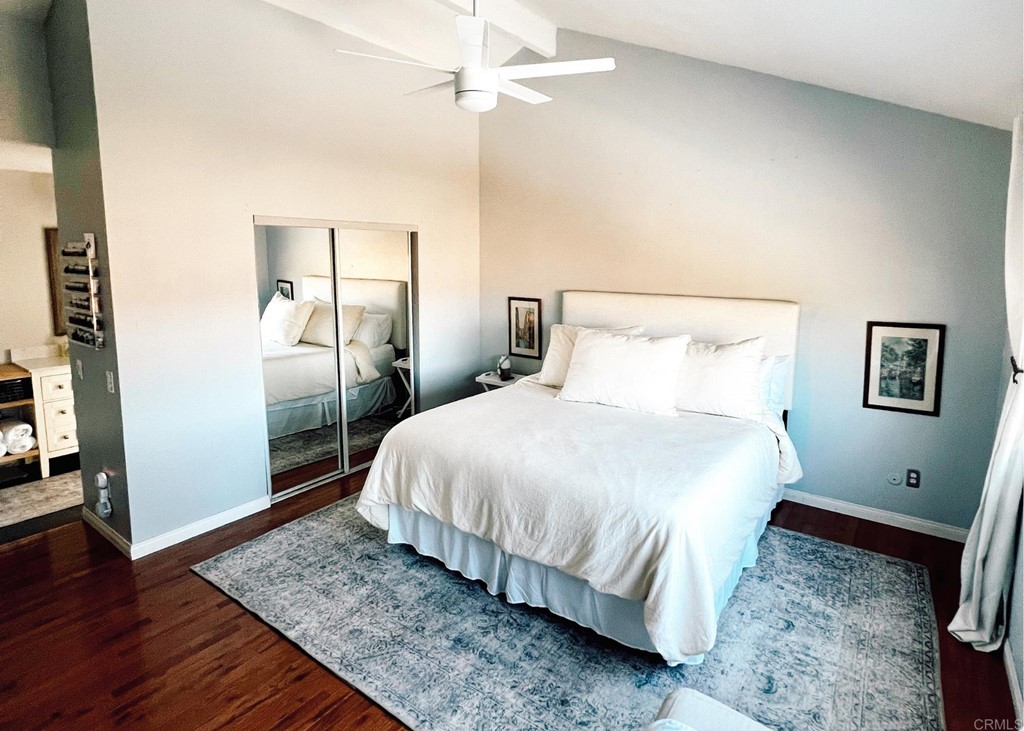 3583 Hatfield Circle Oceanside, CA 92056 - Photo 28 of 32 a bedroom with a bed and wooden floor