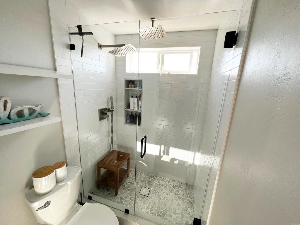 3583 Hatfield Circle Oceanside, CA 92056 - Photo 32 of 32 a bathroom with a sink toilet and shower