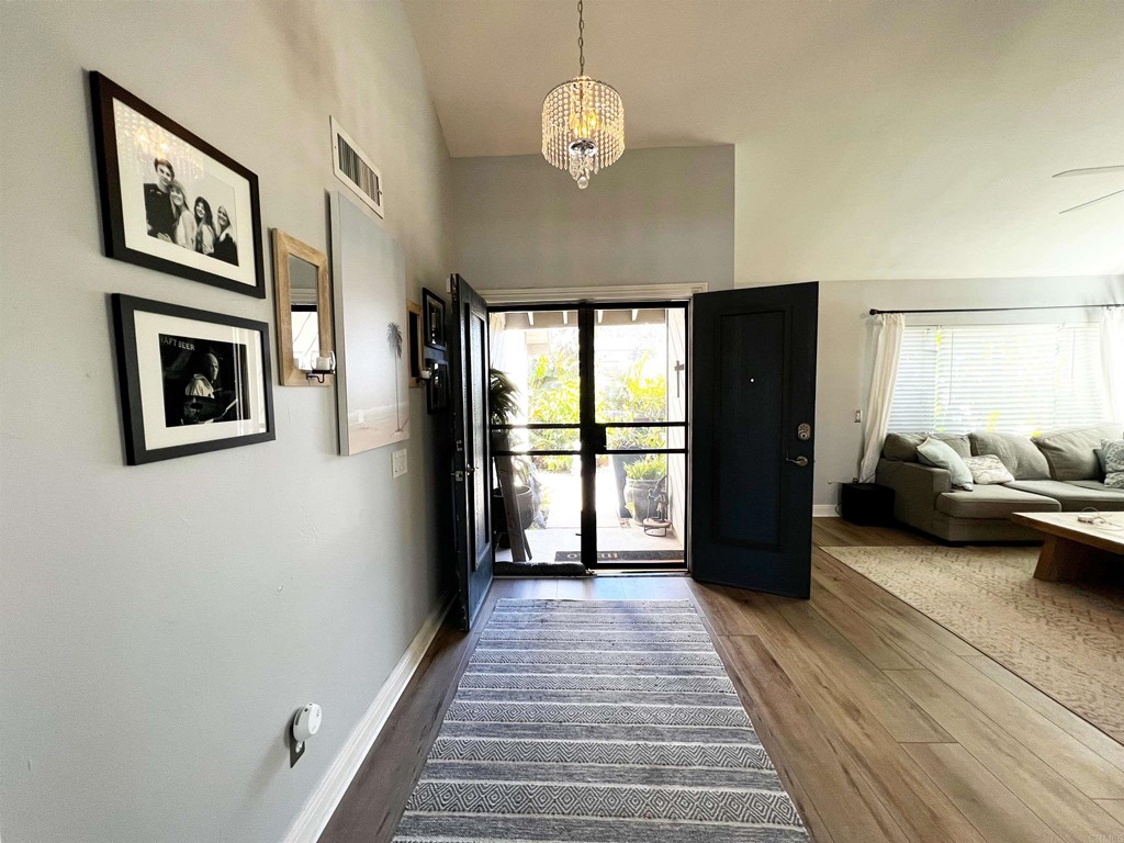 3583 Hatfield Circle Oceanside, CA 92056 - Photo 4 of 32 a view of a bedroom with furniture window and wooden floor