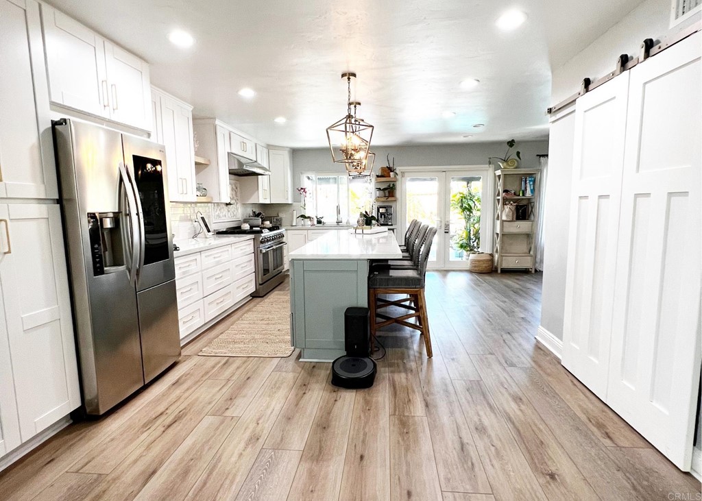 3583 Hatfield Circle Oceanside, CA 92056 - Photo 9 of 32 a kitchen with stainless steel appliances a refrigerator a stove top oven and a refrigerator