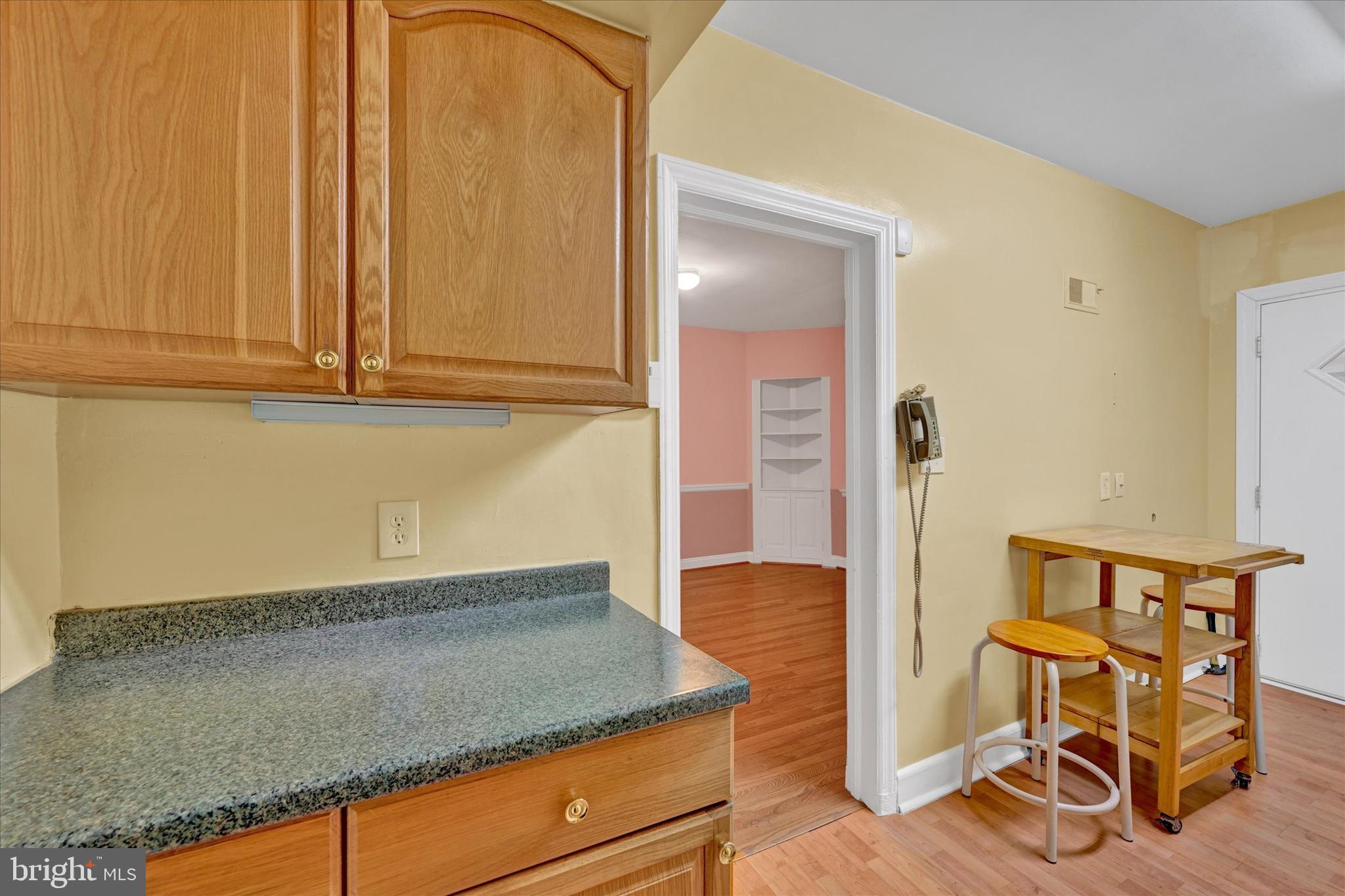 4010 Brookhill Road Baltimore, MD 21215 - Photo 13 of 26 a kitchen with granite countertop next to a window