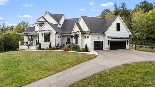 a bathroom with a shower and a sink