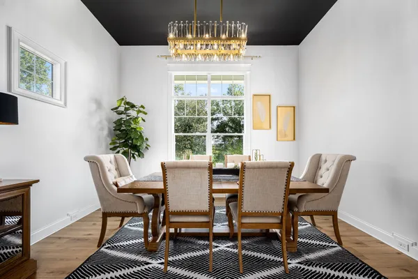 a kitchen with stainless steel appliances wooden cabinets and a table