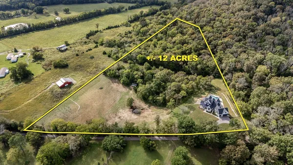 a view of a chairs and table in the balcony