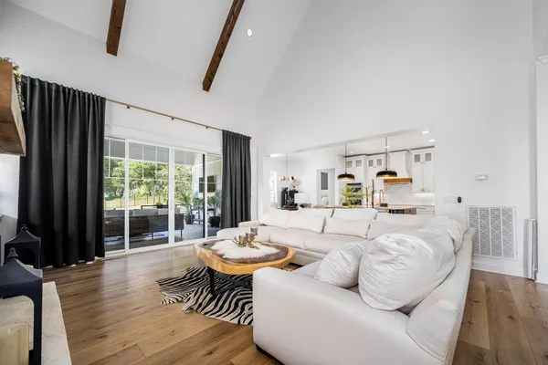 a bedroom with a bed and large window