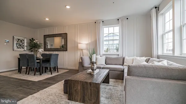 a living room with fireplace furniture and a flat screen tv