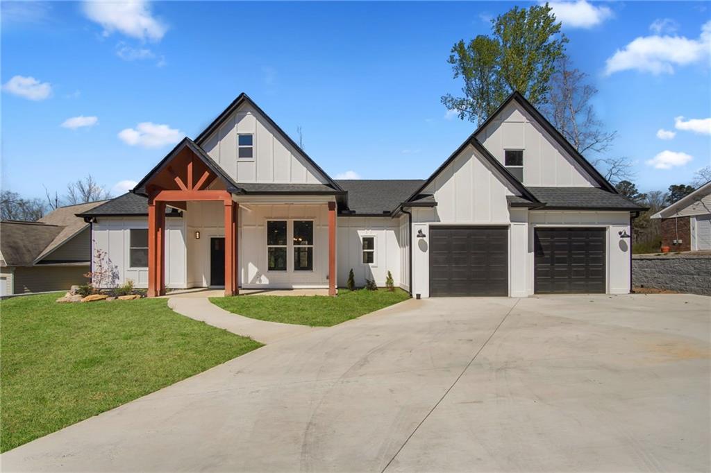 114 Thornwood Drive Southwest Rome, GA 30165 - Photo 1 of 1 a front view of a house with a yard and garage
