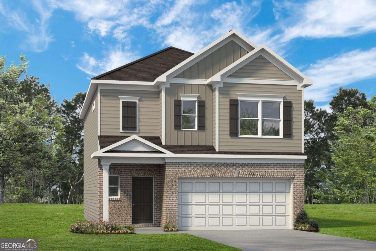1429 Trellis Court, Unit (LOT 9) Hampton, GA 30228 - Photo 2 of 28 a front view of a house with a yard