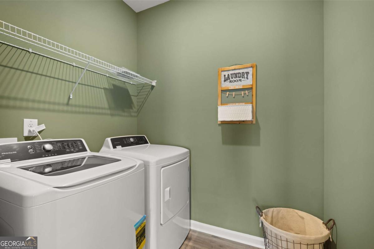 1429 Trellis Court, Unit (LOT 9) Hampton, GA 30228 - Photo 28 of 28 a utility room with dryer and washer