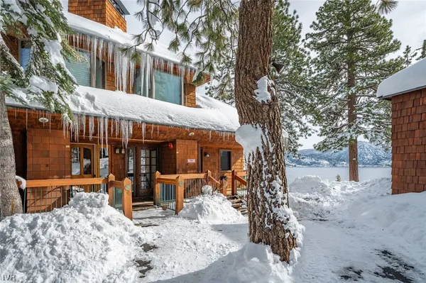 a view of a house with a tree