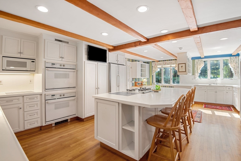 21 Topsfield Road Boxford, MA 01921 - Photo 13 of 42 a kitchen with kitchen island a stove a sink and a refrigerator