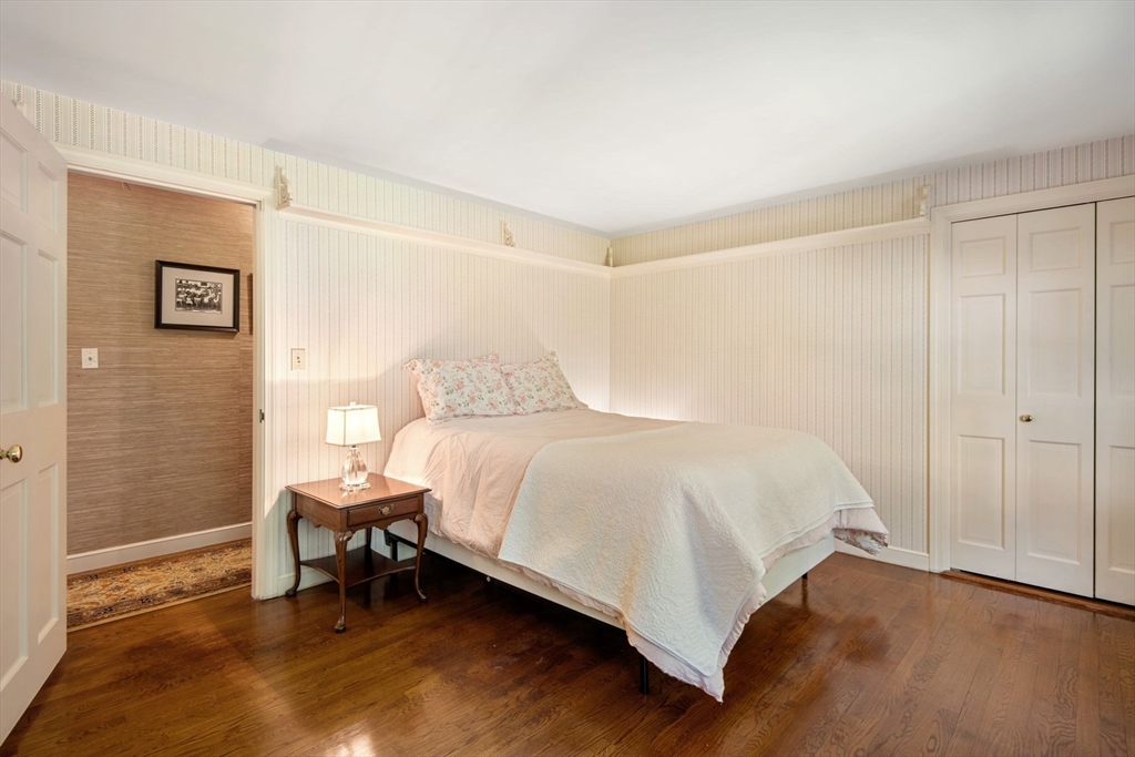 21 Topsfield Road Boxford, MA 01921 - Photo 26 of 42 a bedroom with a bed and a table in it