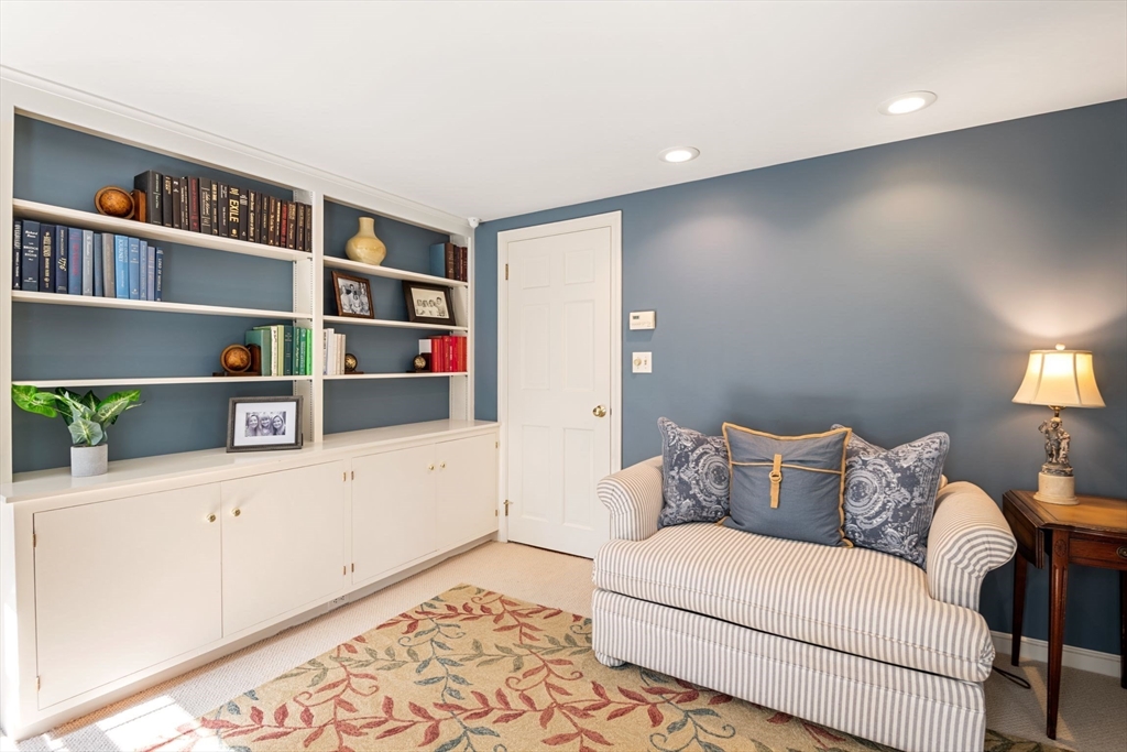 21 Topsfield Road Boxford, MA 01921 - Photo 28 of 42 a living room with furniture and a book shelf