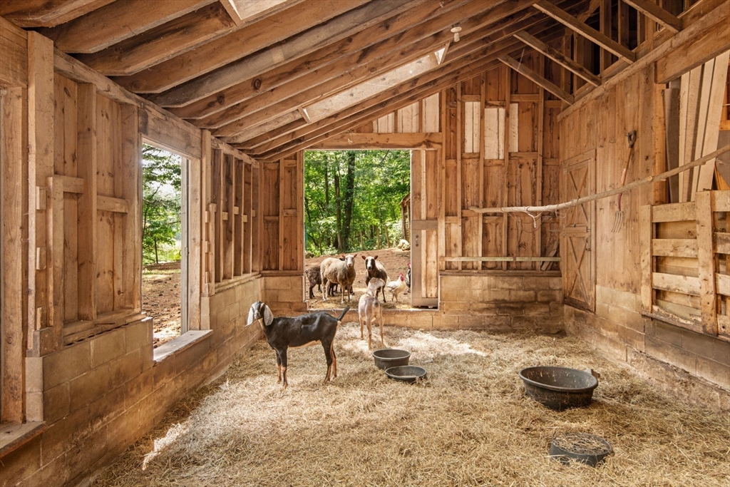 21 Topsfield Road Boxford, MA 01921 - Photo 34 of 42 a living room with a couch and a table