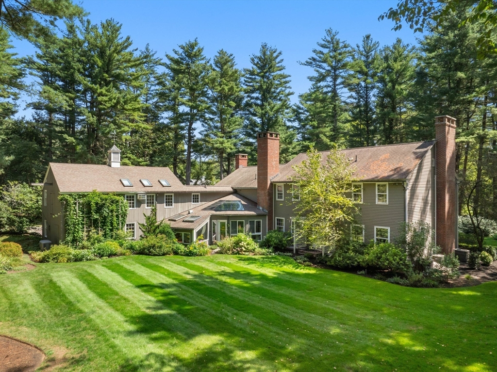 21 Topsfield Road Boxford, MA 01921 - Photo 6 of 42 a front view of a house with a yard