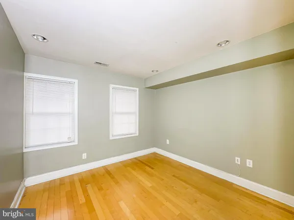 a room with a bed and a window