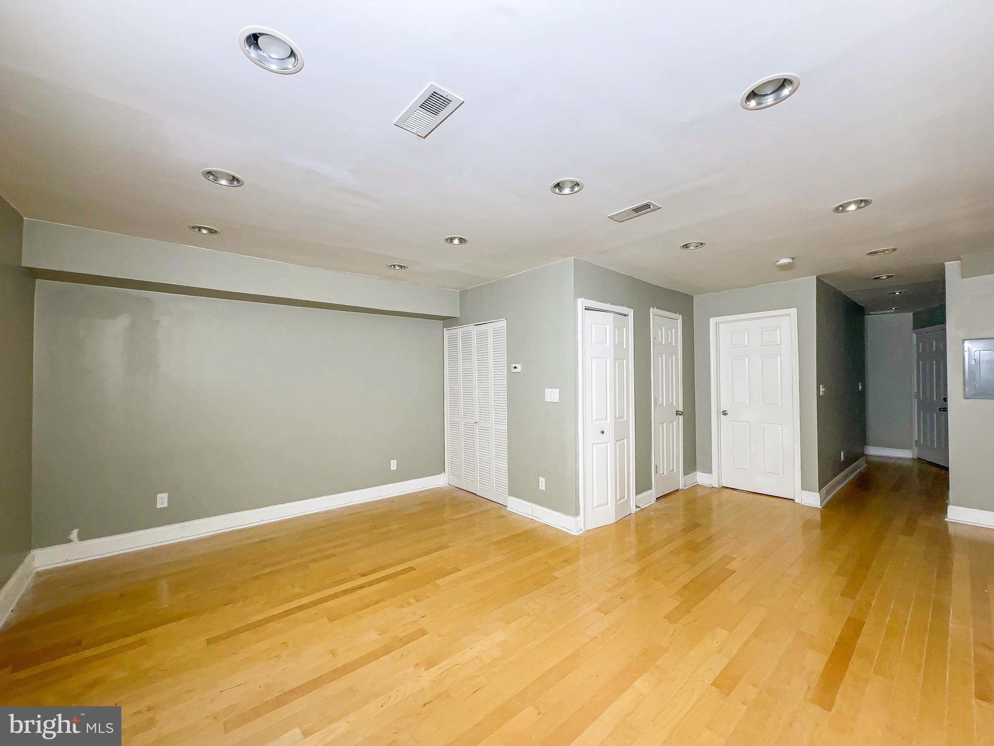 1835 D Street Northeast Washington, DC 20002 - Photo 16 of 42 a view of a big room with wooden floor and bedroom