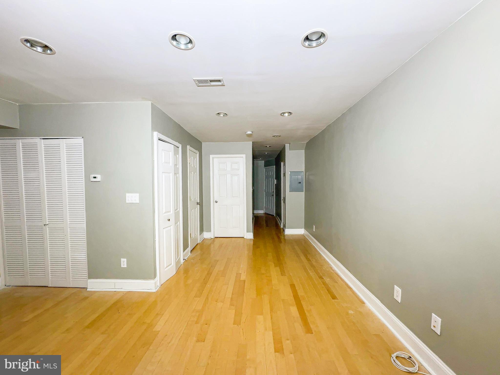 1835 D Street Northeast Washington, DC 20002 - Photo 17 of 42 a bedroom with a bed and a walk in closet