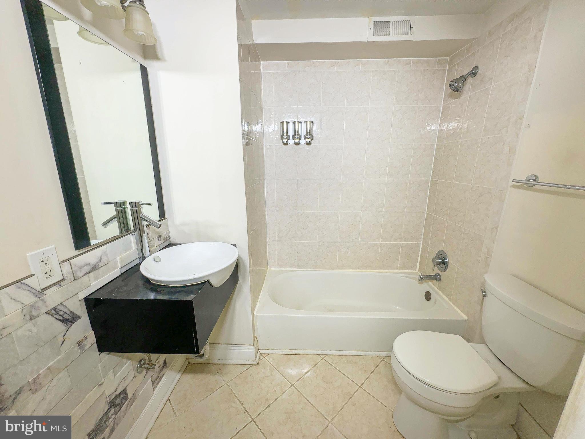 1835 D Street Northeast Washington, DC 20002 - Photo 22 of 42 a bathroom with a sink toilet and shower